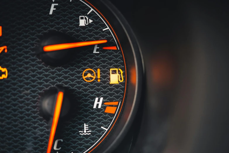 an illuminated instrument cluster in a car showing it's fuel level