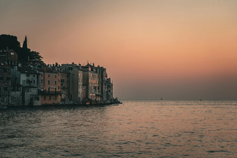 the city and buildings are along the shore