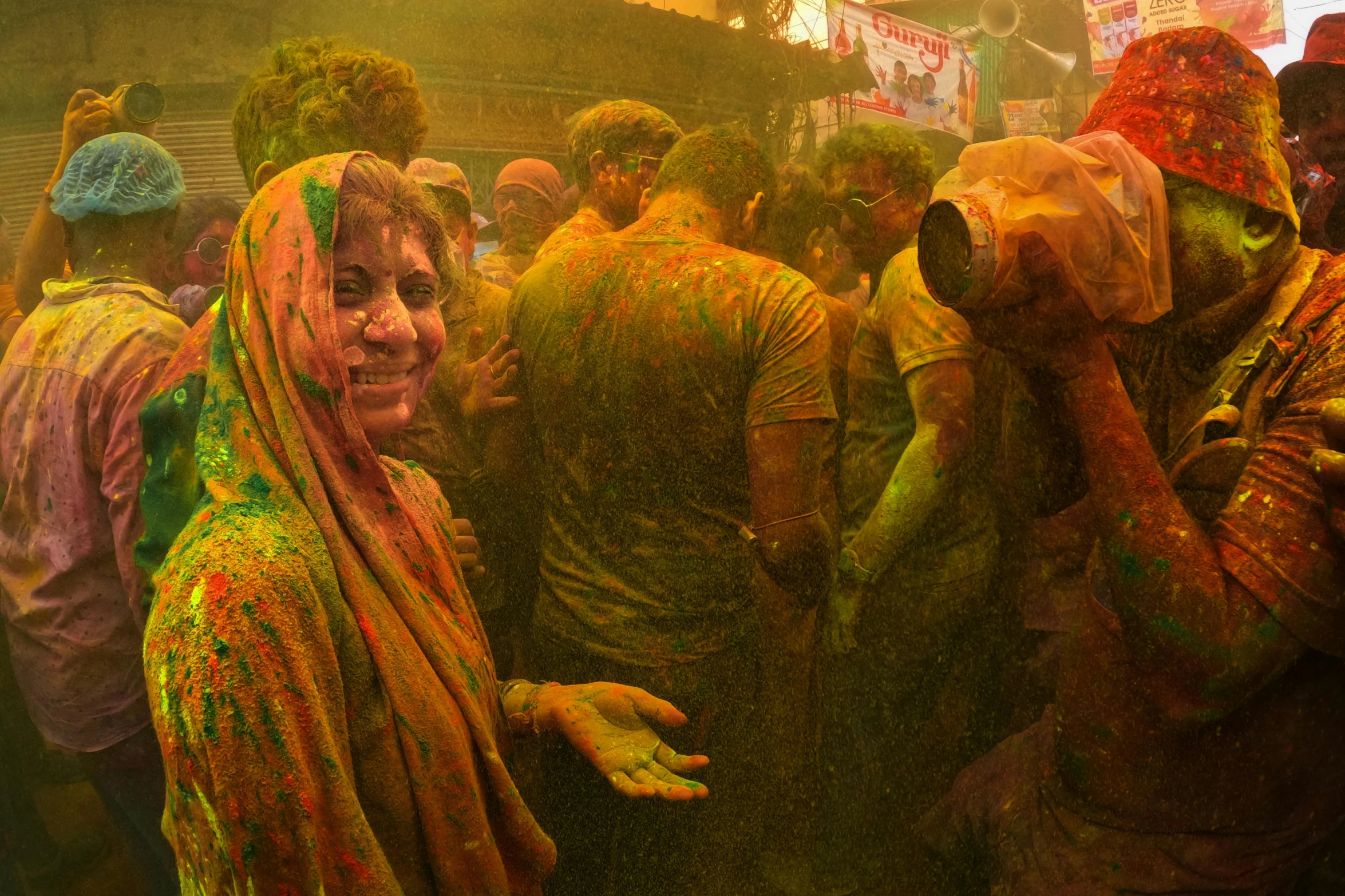 a group of people in colorful powdered clothes are in the middle of a crowd