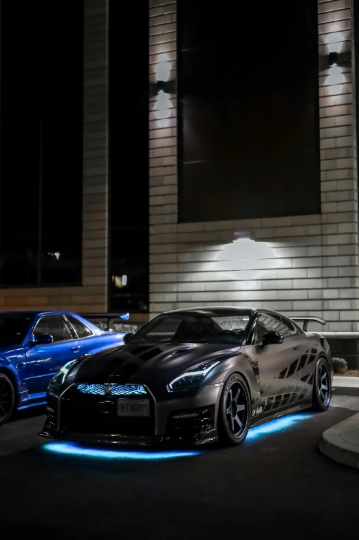 two sports cars parked on the side of the road