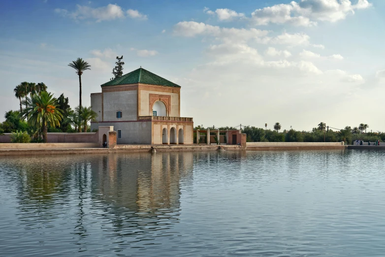 an old tower structure sitting on top of a river