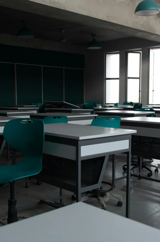 an empty room with desks and chairs