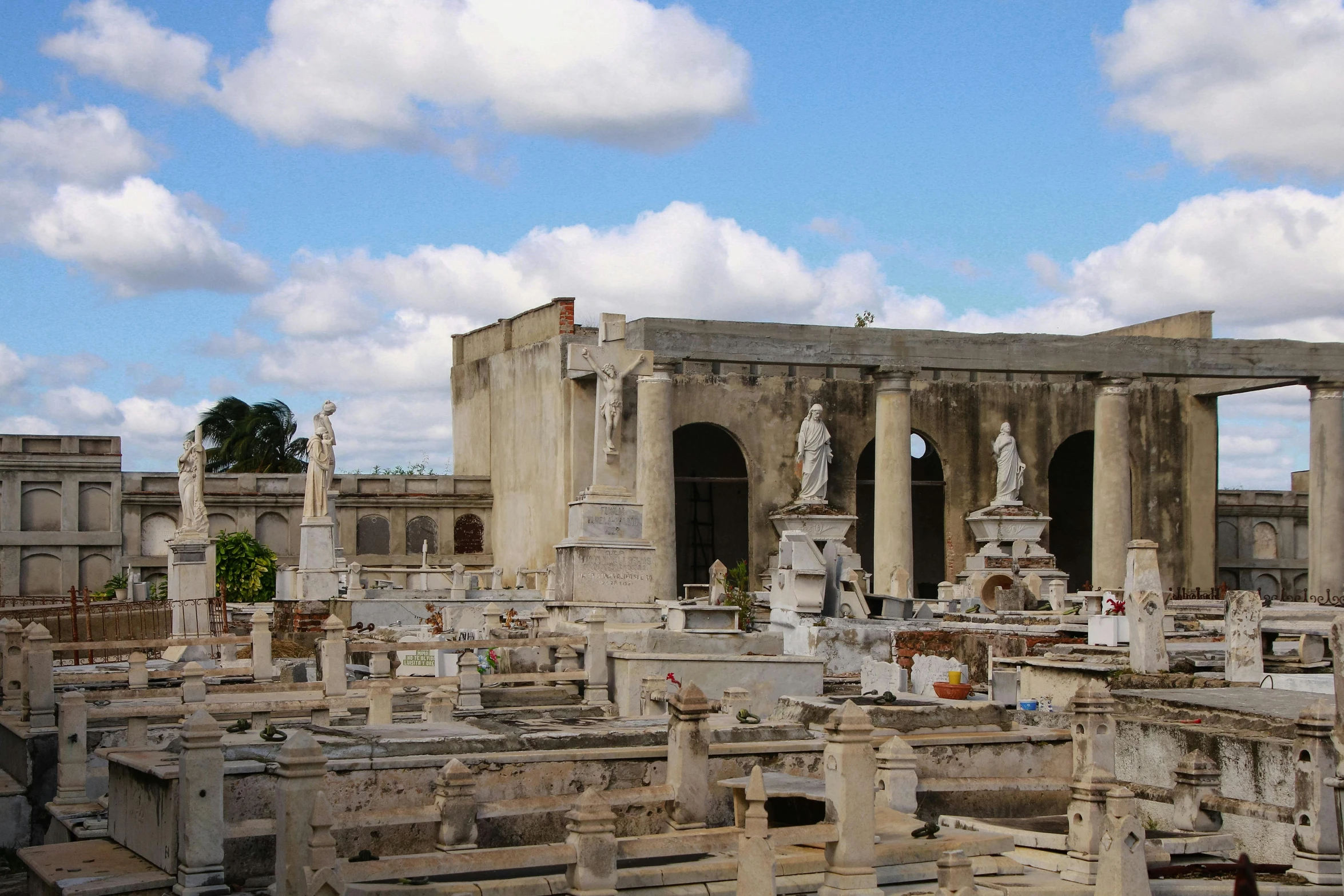 an old cemetery with sculptures in the middle