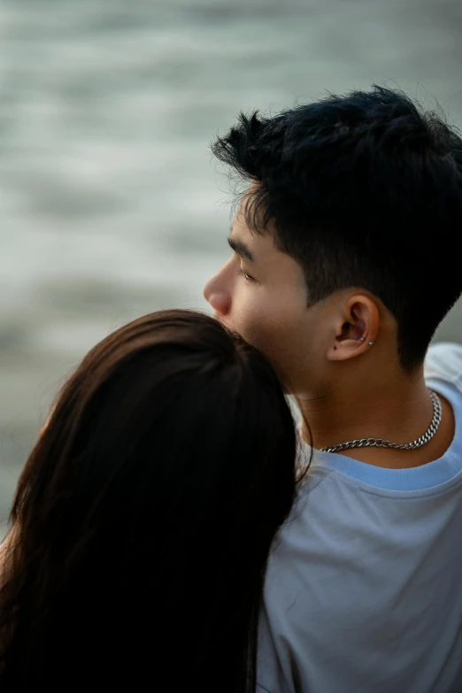 a close up of two people touching their backs