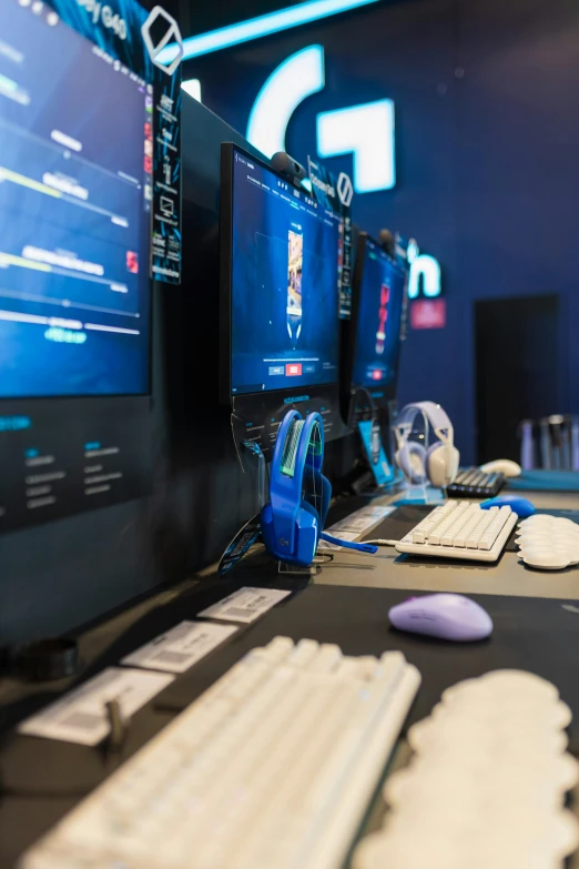 a desk topped with a computer and monitors