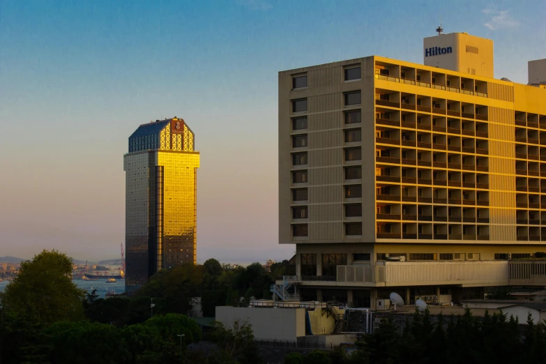 a yellow building is seen in the foreground and a blue building in the background