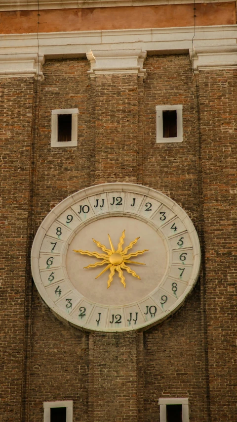 a clock on a brick tower displaying the time