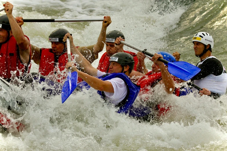 a group of young people in a raft on rapids