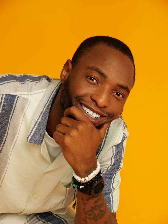 an african american man smiling at the camera