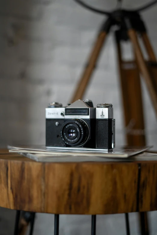 an old fashioned camera on top of a table