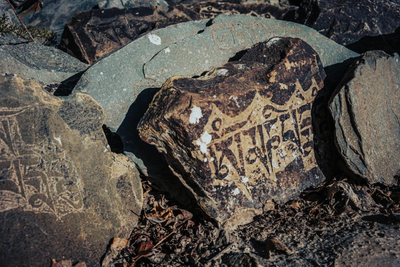 two rocks have different pictures on them