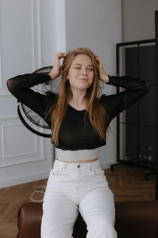 a woman posing for a po on the chair