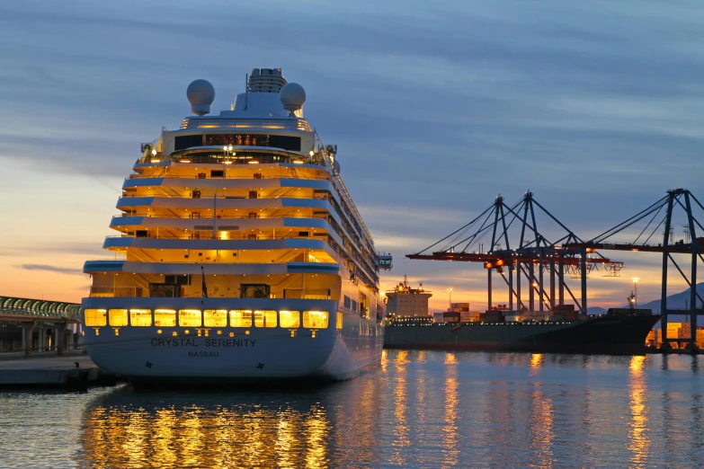 a cruise ship sitting at a dock near a pier