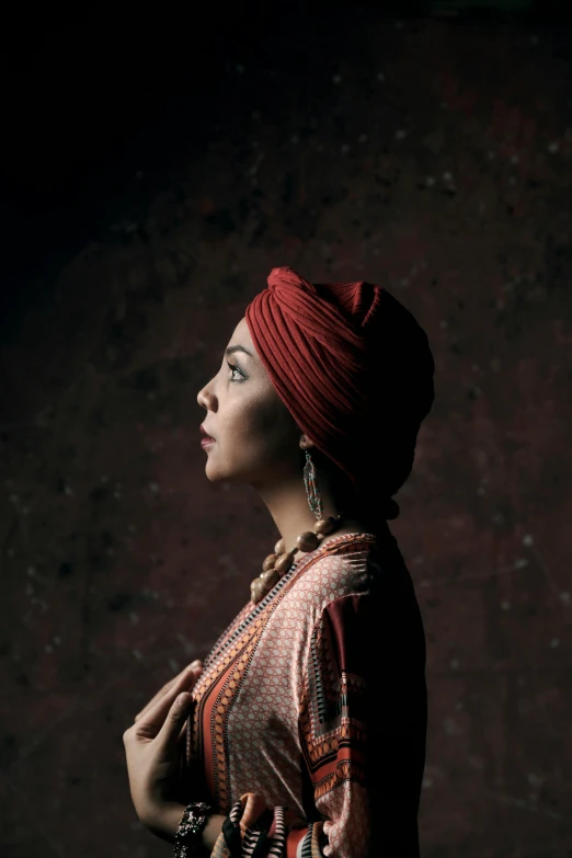 woman wearing an indian costume standing in the dark