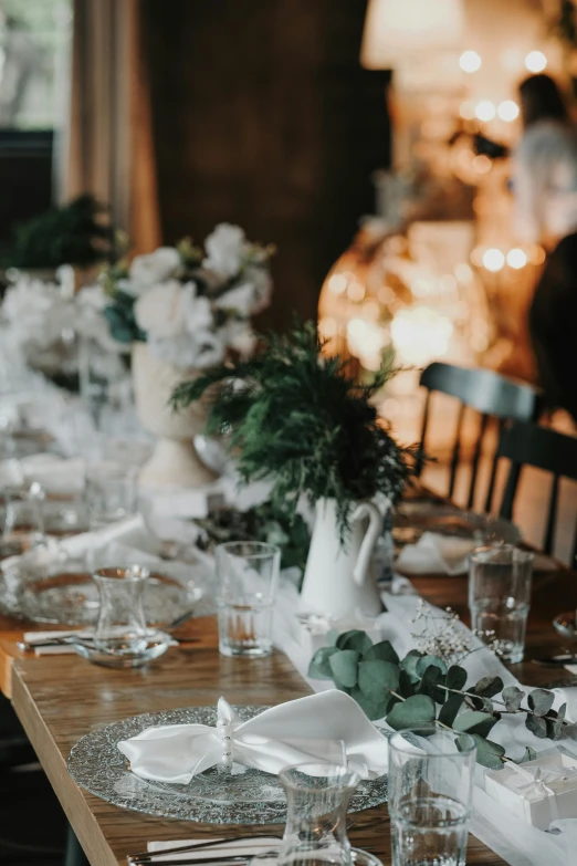 a table with several tables and white plates