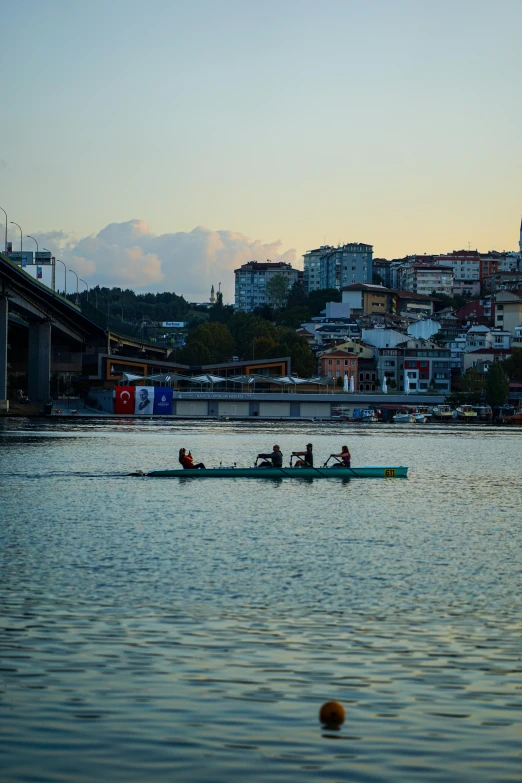 a group of people on a boat in the water