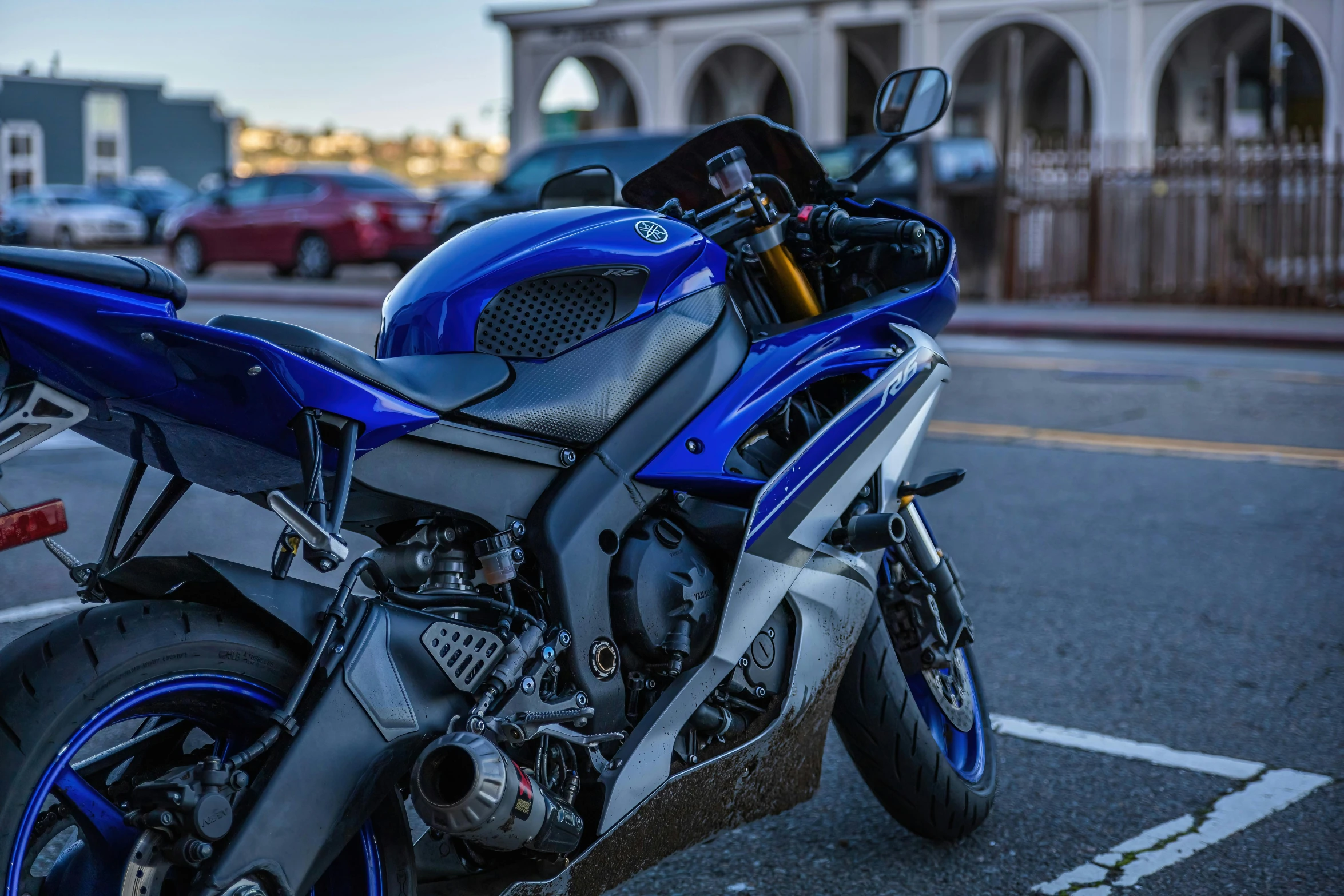 the motorcycle is parked in the parking lot