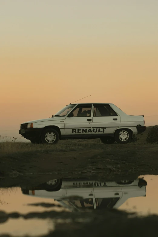 an image of a car parked at the water's edge