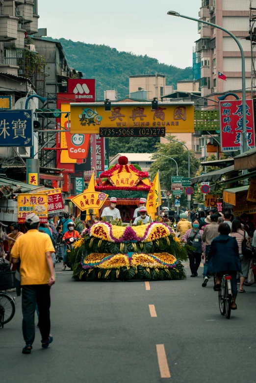 a colorful float driving down a city street