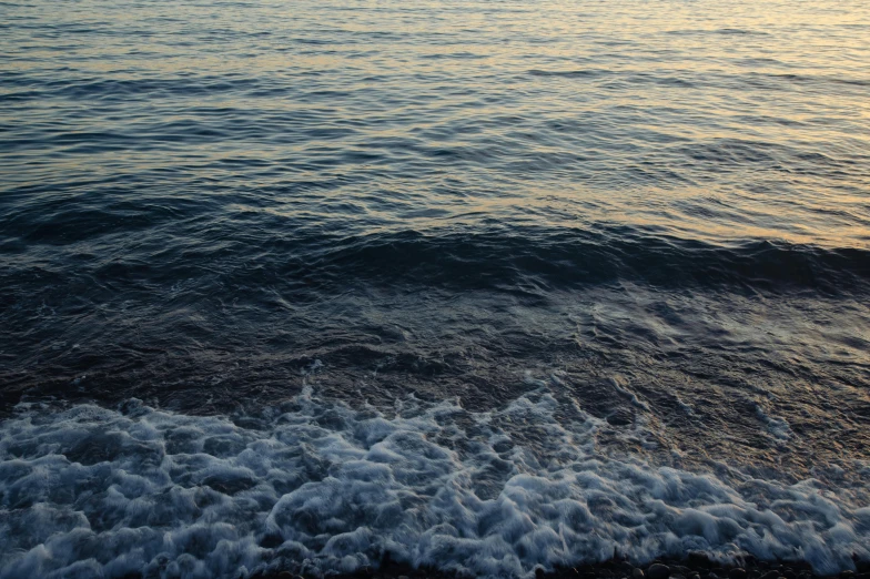 a body of water with waves in the front