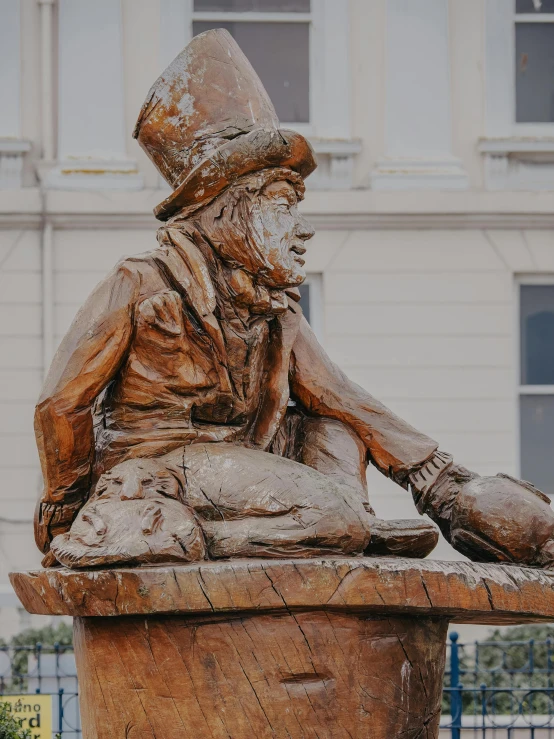 a statue in the center of the city of a stone sculpture