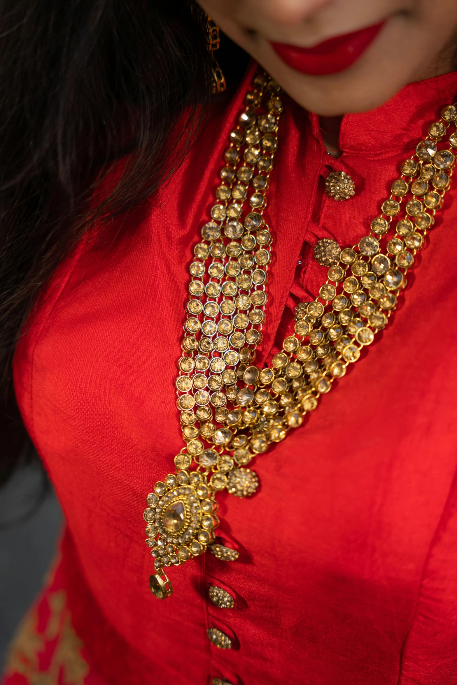 a close up of a person wearing gold chains