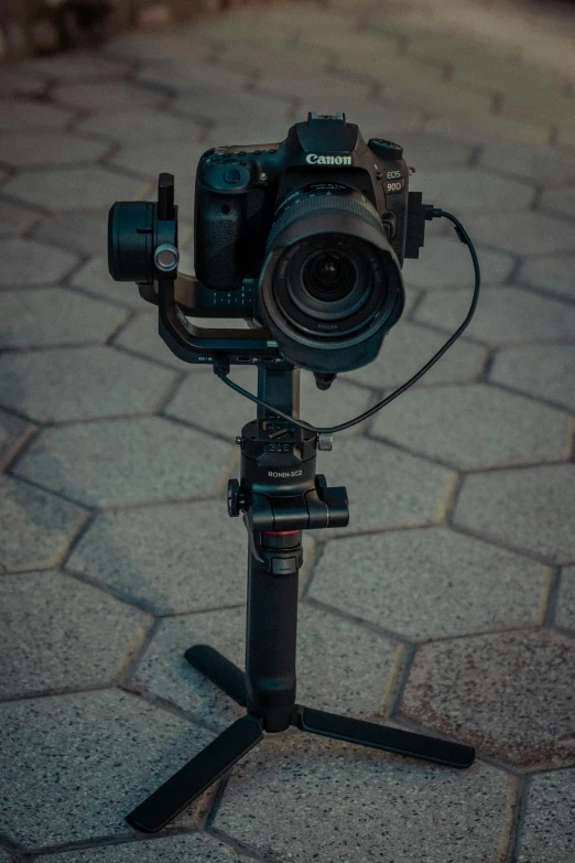 a tripod has a camera attached to it