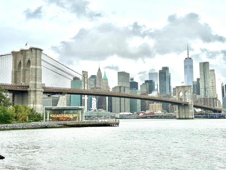 the city and bridge are by the water