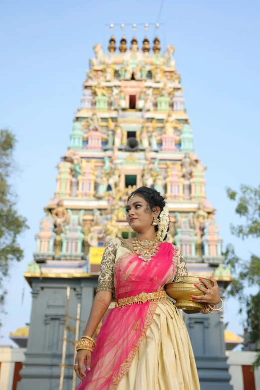 woman in traditional dress with large multi colored gopali