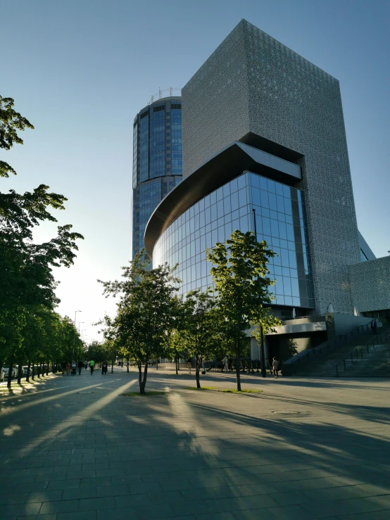 a building on top of a street surrounded by trees