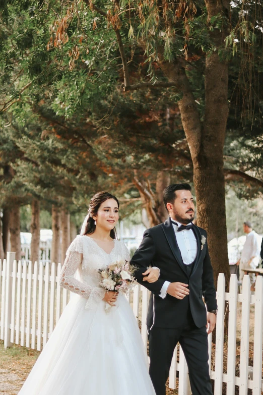 a woman and a man standing next to each other