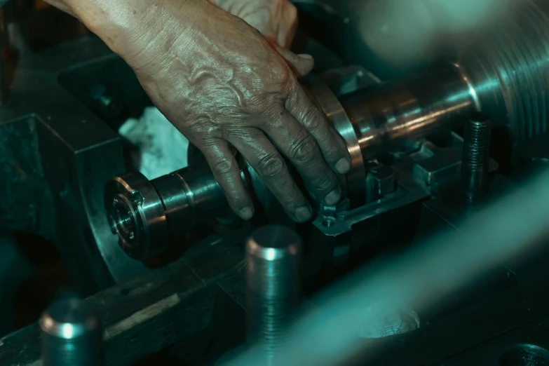 a person is pressing metal with a machine