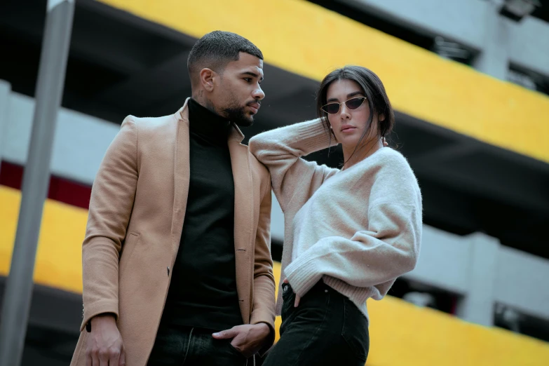 a couple walking outside with an umbrella on