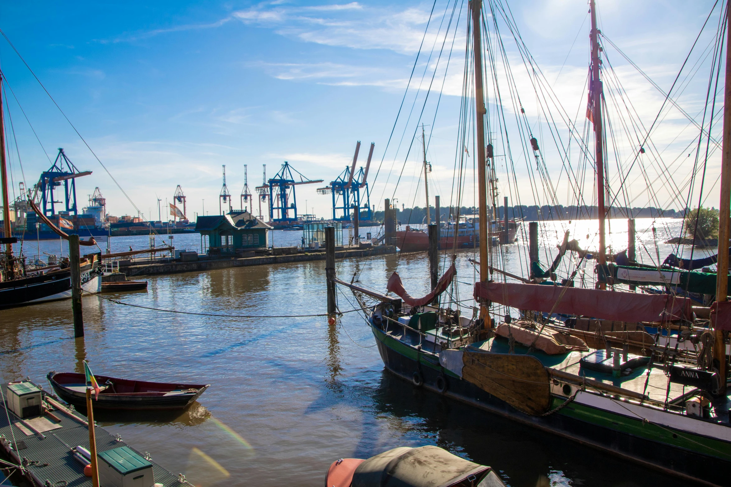 a row of ships docked at a large port