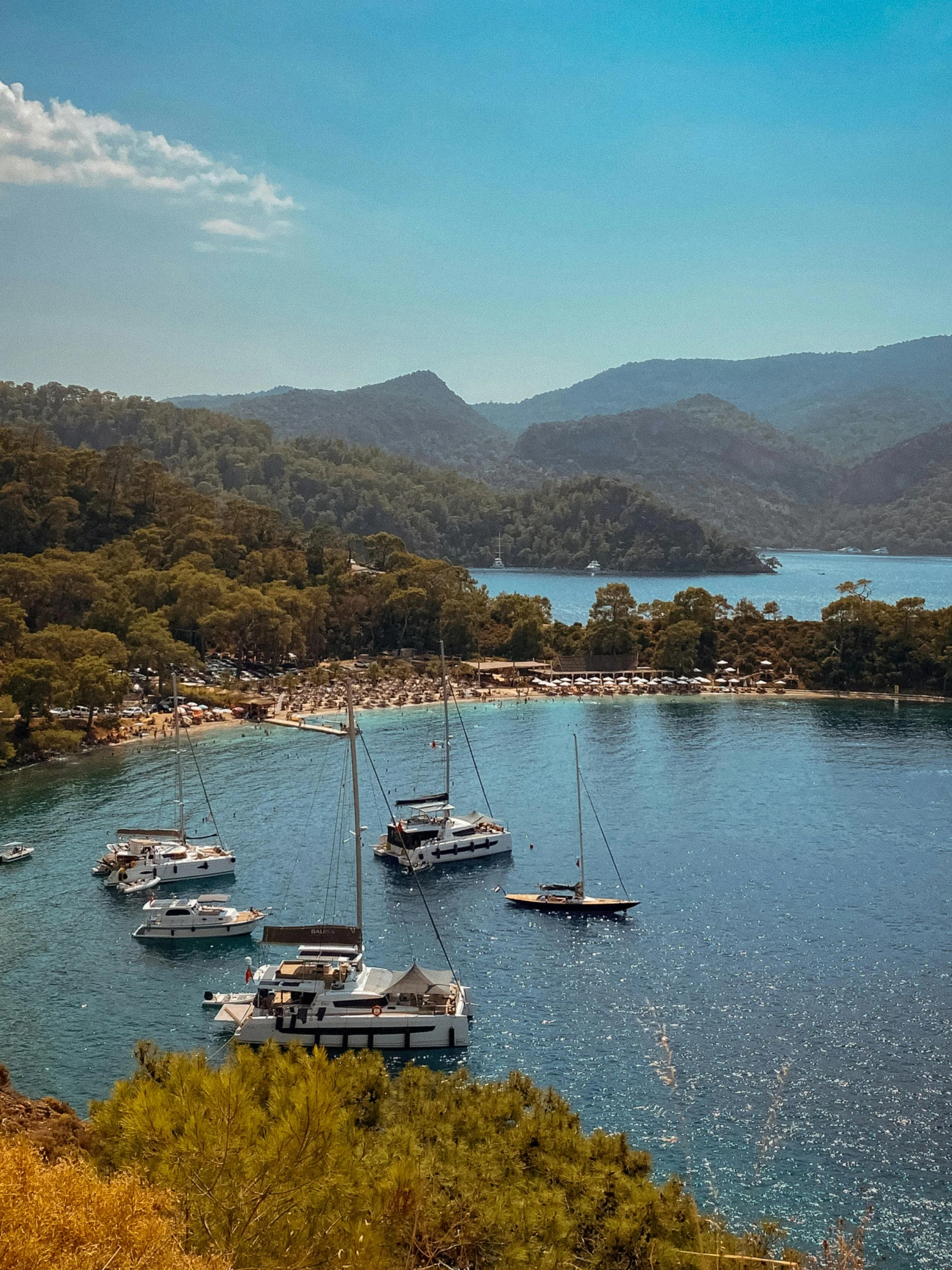 a number of small boats on a body of water