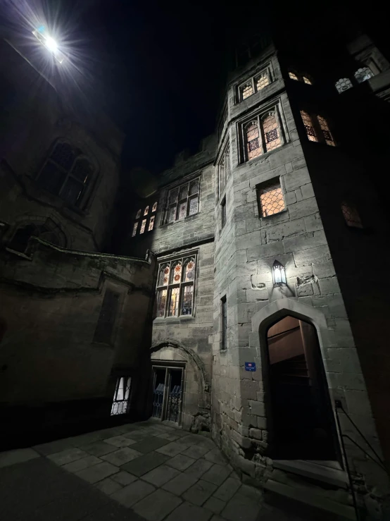 a clock on a brick building at night