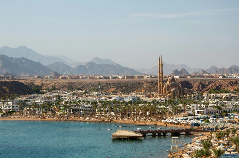 the beach is full of boats and some buildings