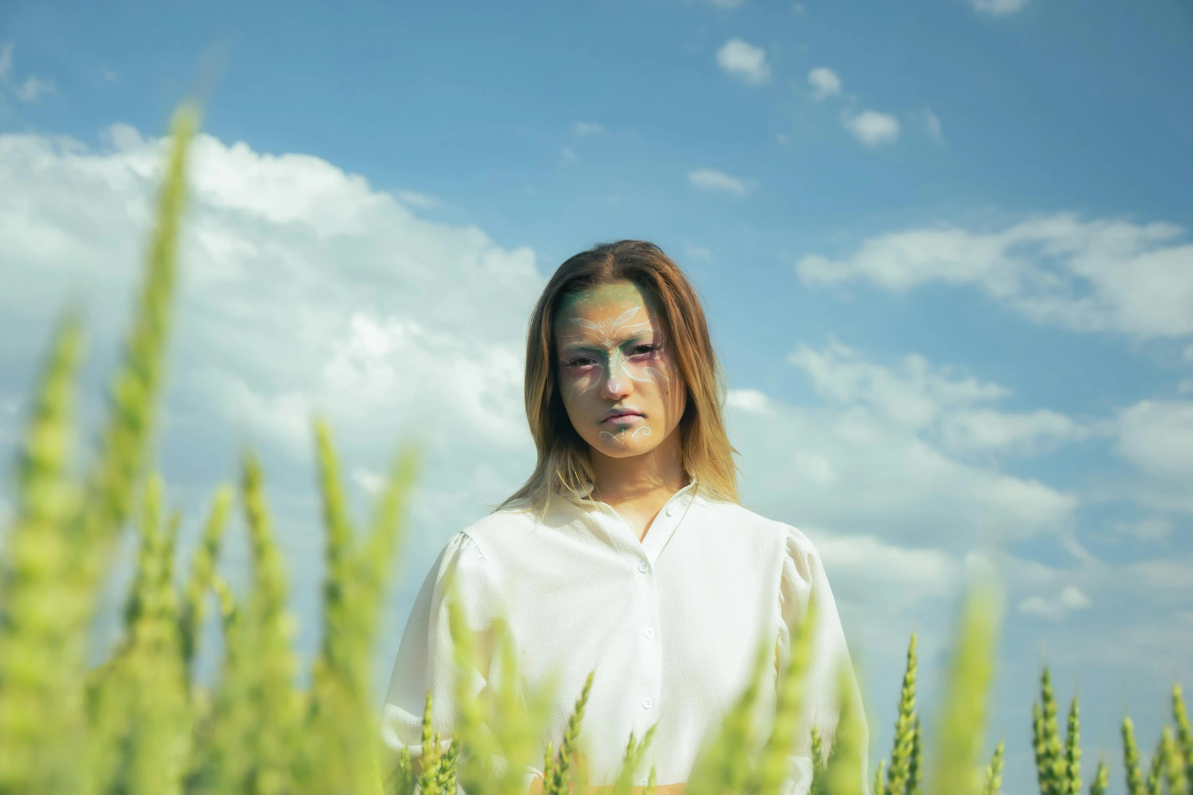 there is a woman that is in the middle of some plants