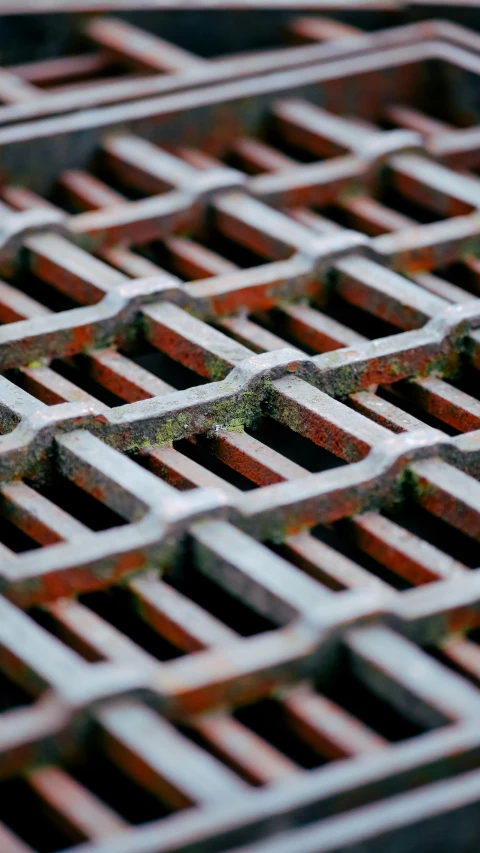 close up of a brick pattern on an iron grill