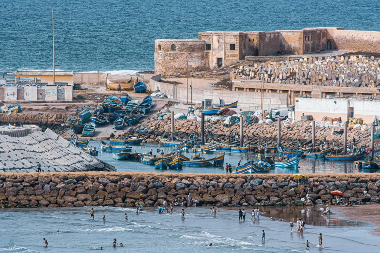 large boats docked next to the beach