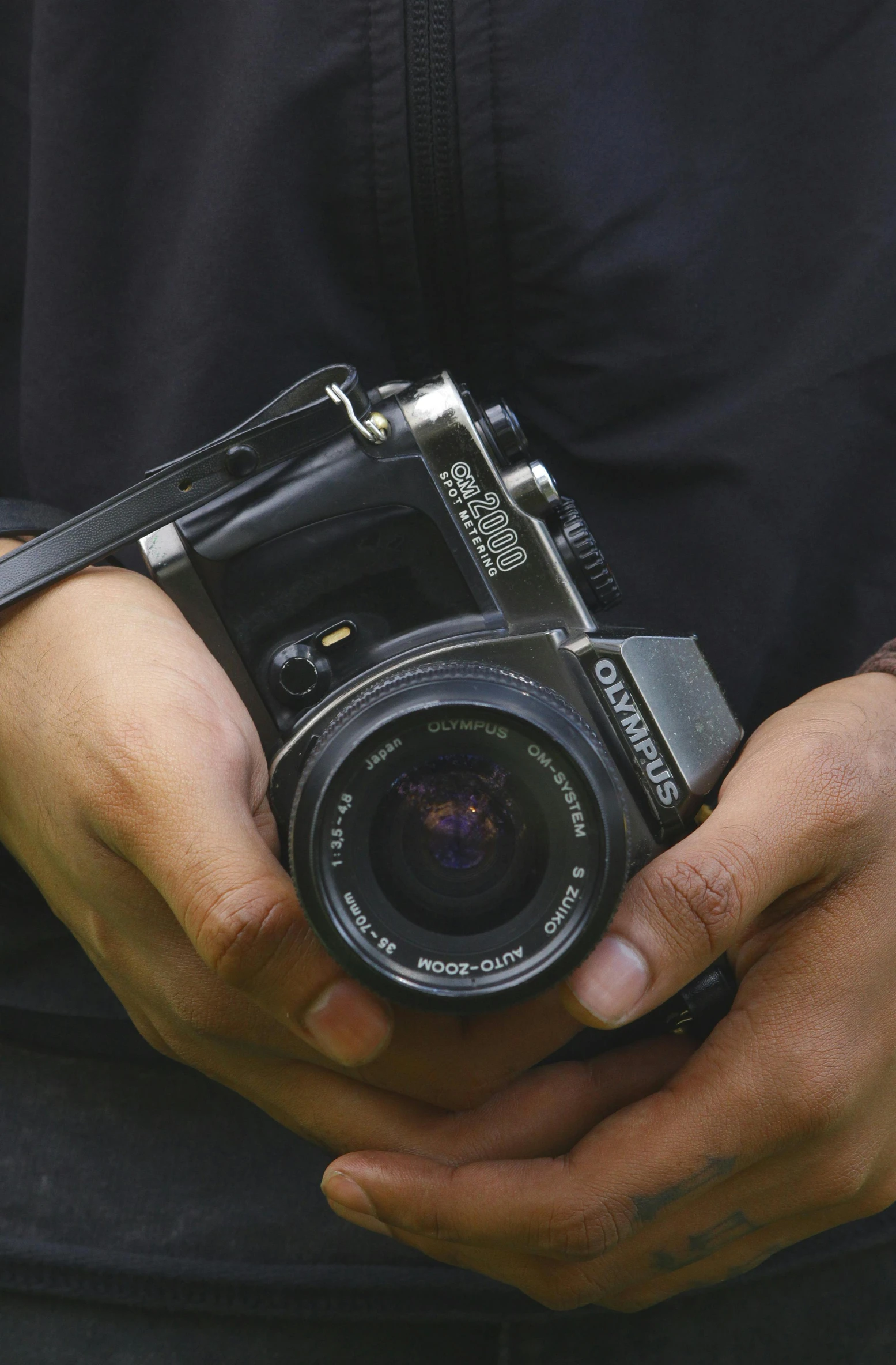 a man holding a camera with his hand