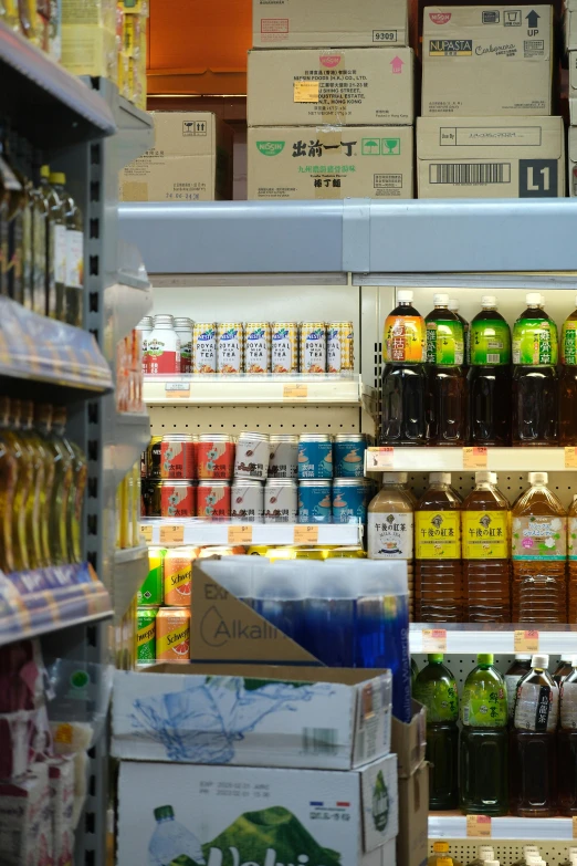 the refrigeration room has various drinks on shelves