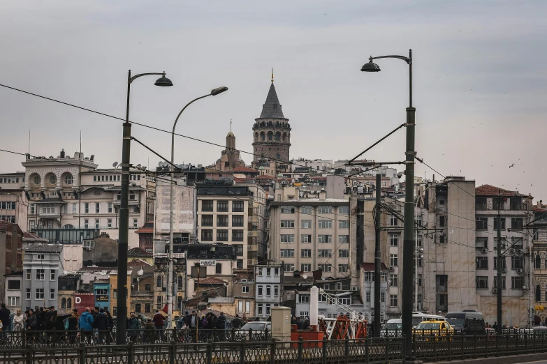 a city with a tall building near many traffic lights