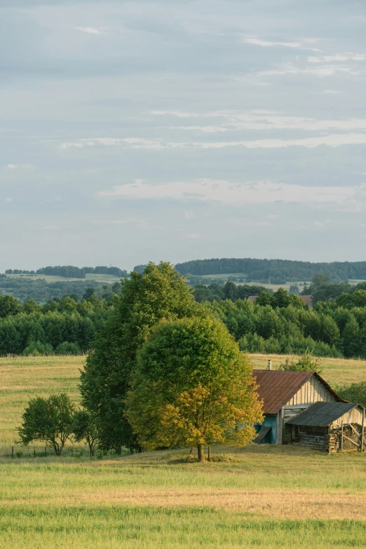 a small home sits alone in an open field