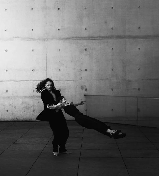 woman playing with a toy in front of a wall