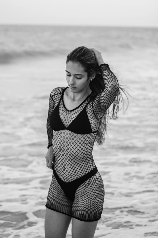 a beautiful young woman in a short black and white bikini