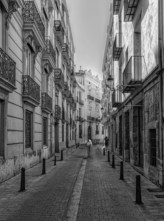 a person walking down a long empty road