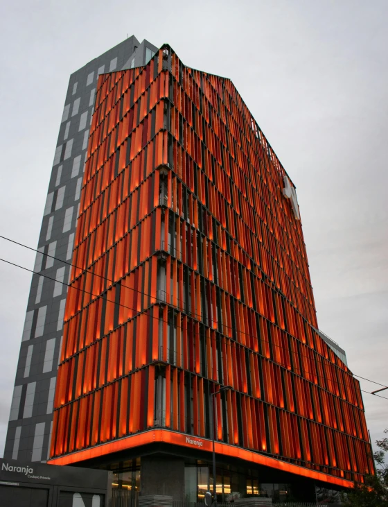 the building has an orange brick facade on the corner