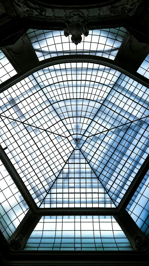 blue - tinted po of a decorative roof with glass on top