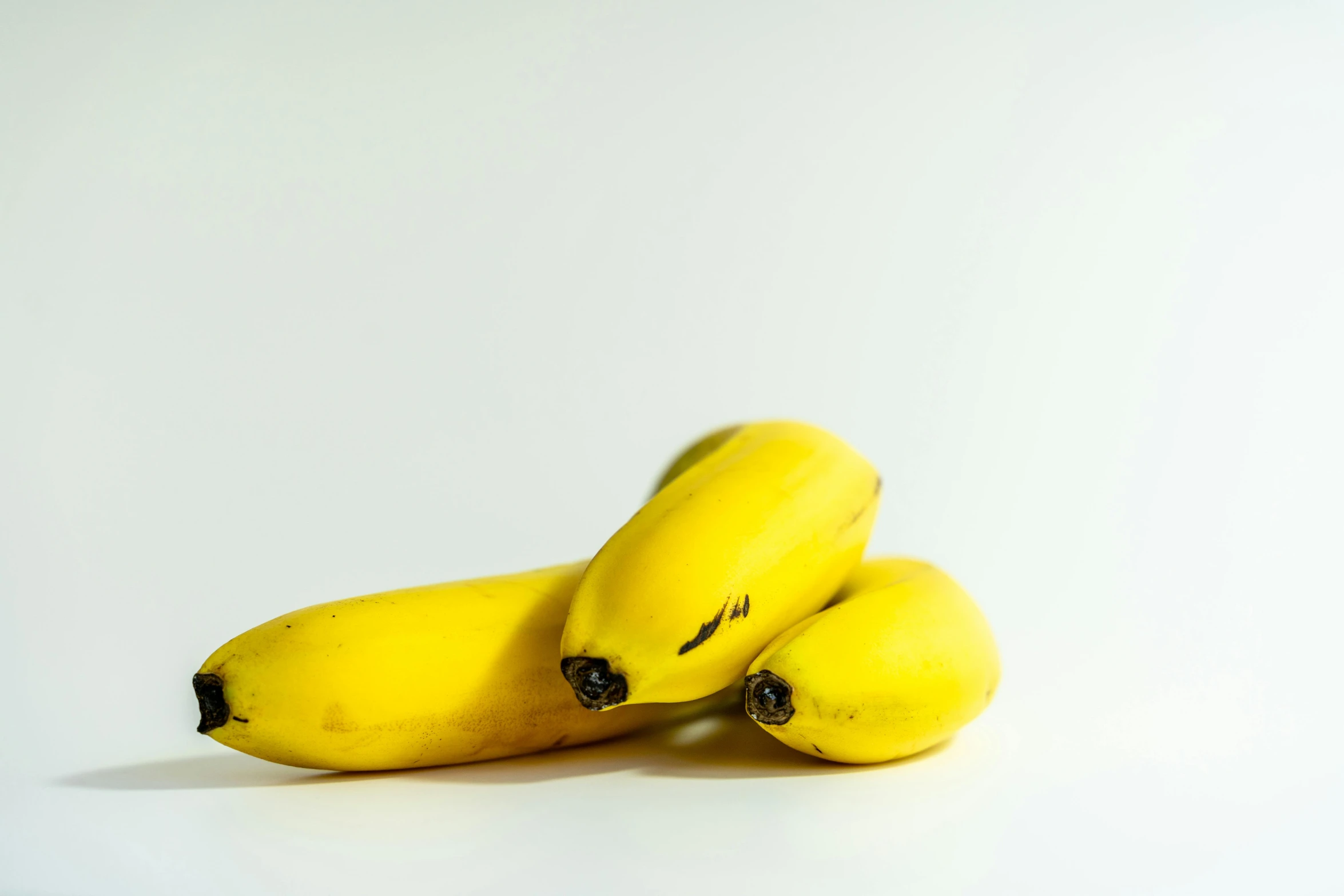 three bananas piled on top of each other